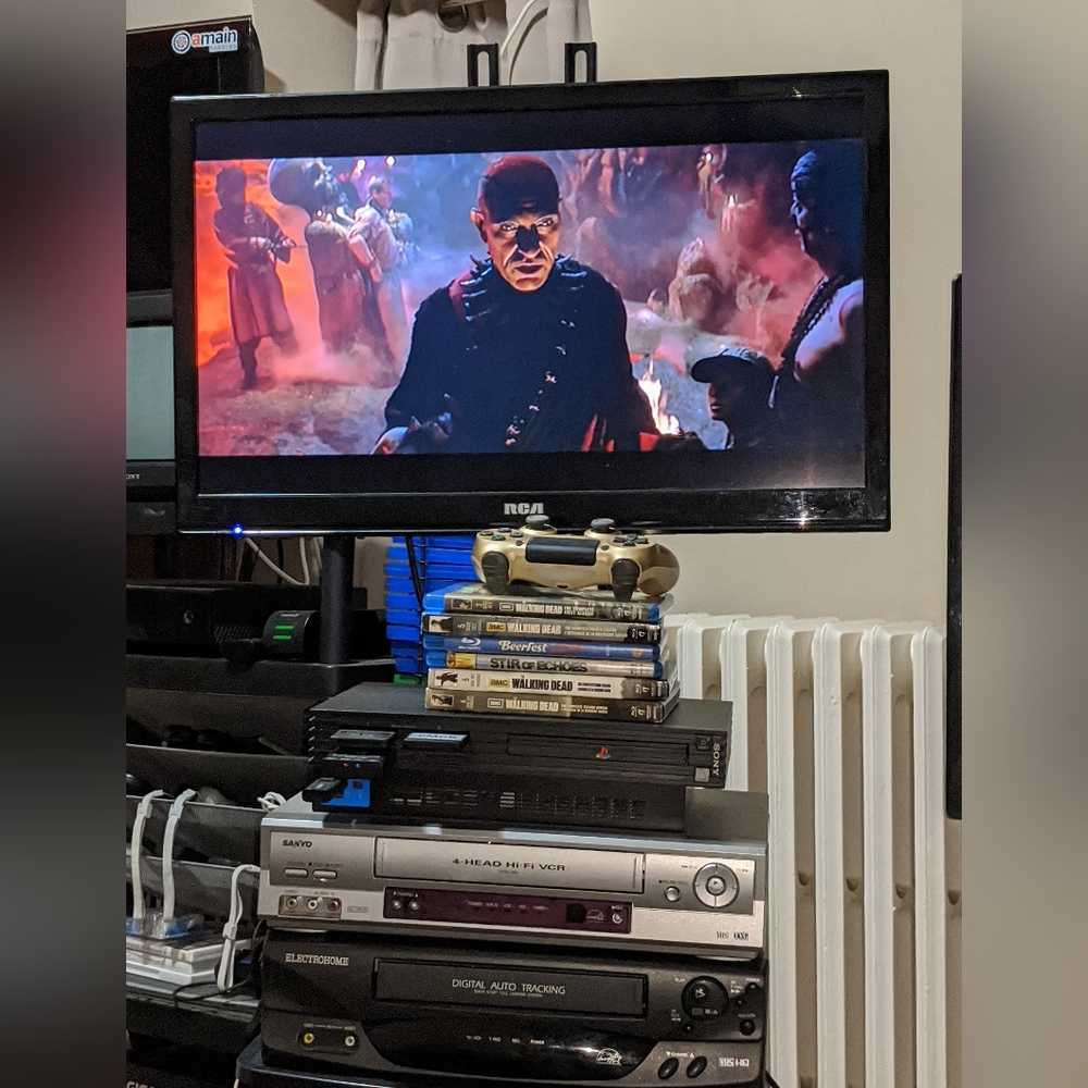 Dramatic Black PS2 and Blue Media VHS / VCR / DVDs & Blu-ray Discs